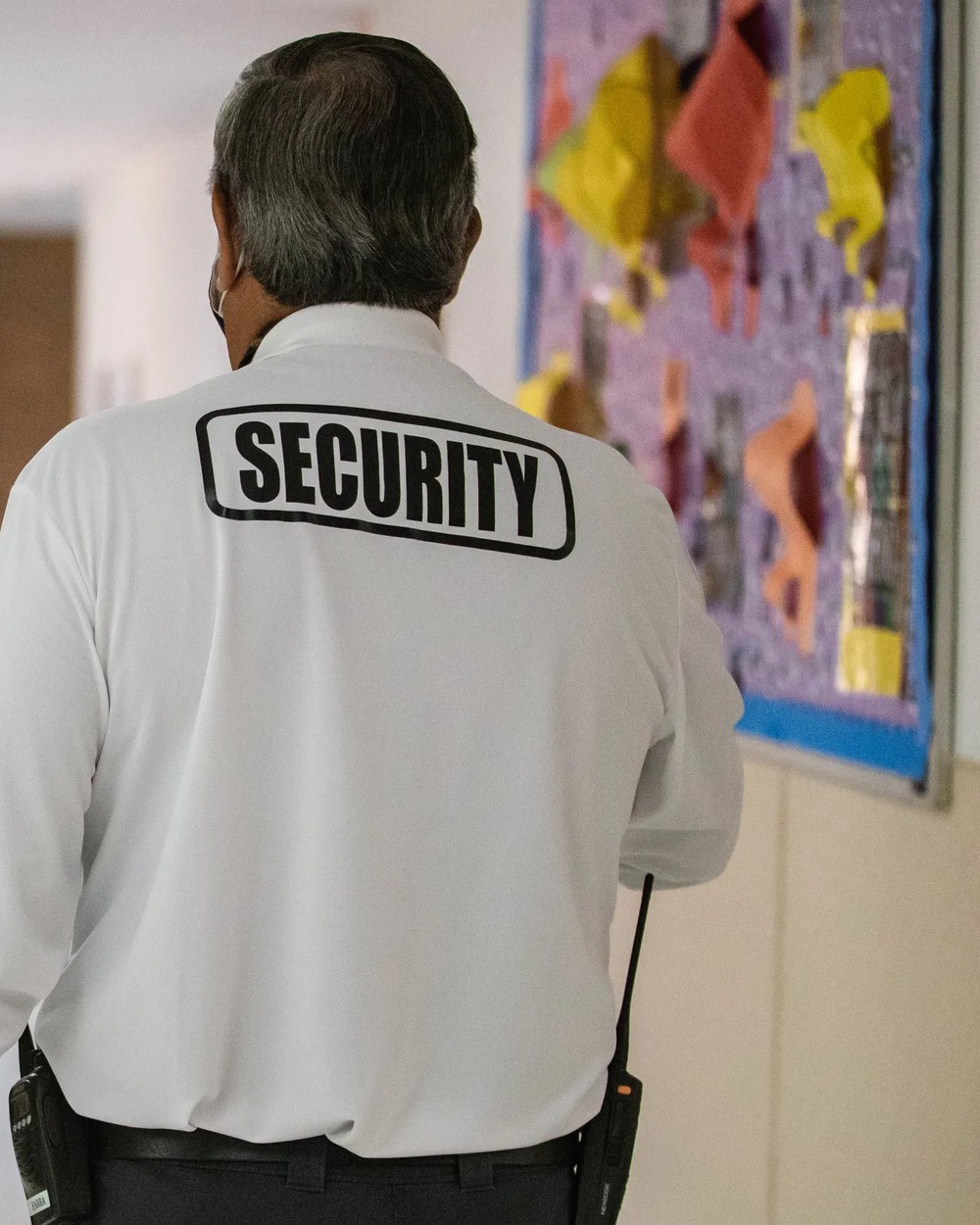 School security officer with SECURITY logo on shirt